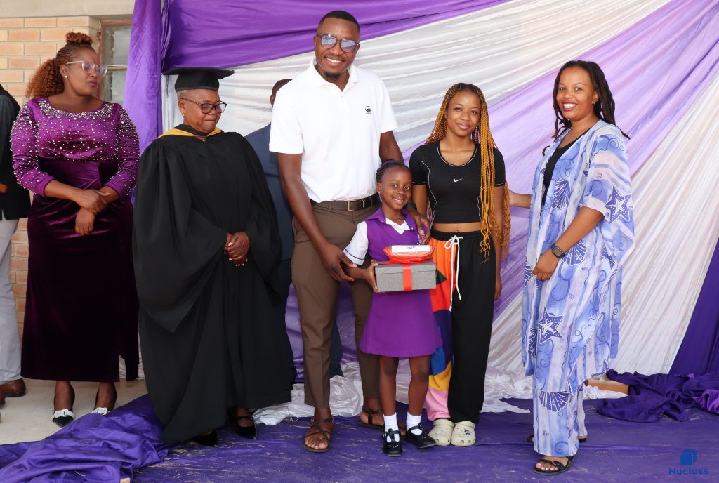 Learner receiving an award during a primary school prize giving ceremony in Plumtree, Zimbabwe.