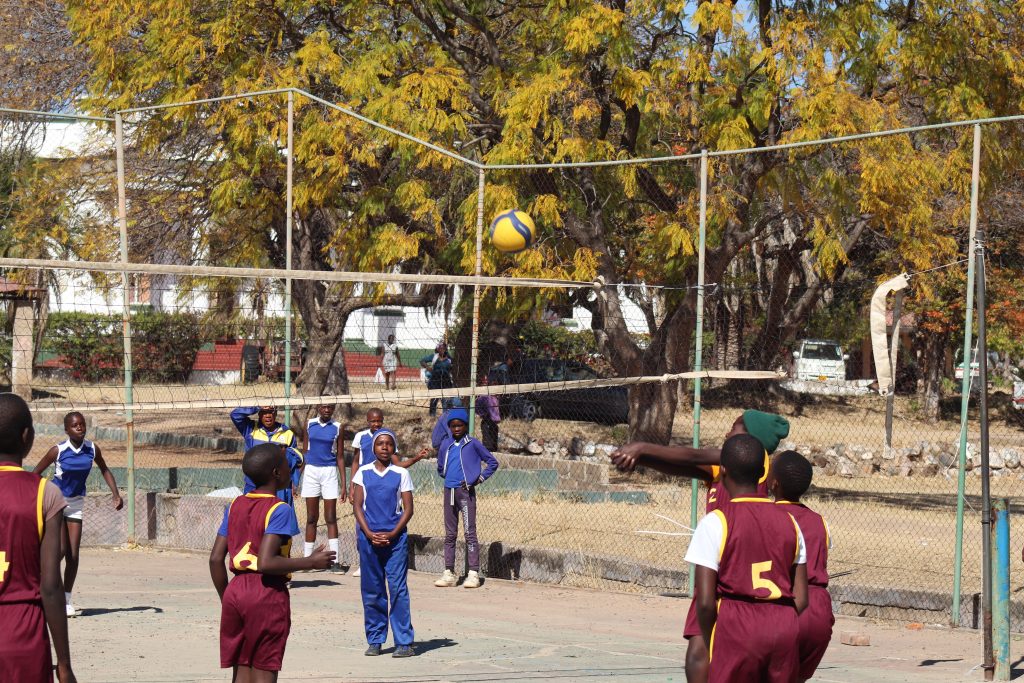 Learners competing in volleyball during primary school ball games held at Plumtree High School