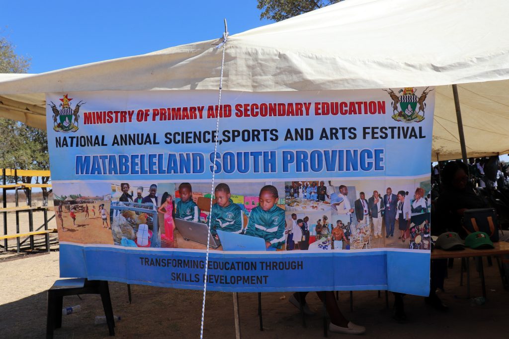 Exhibition banner at the Provincial Annual Science, Sports and Arts Festival (PASSAF) in Matabeleland South, highlighting skills development and heritage-based education in Zimbabwe.